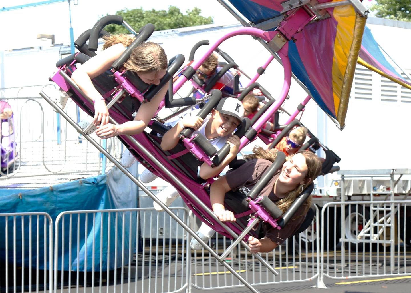 Kids have fun on the carnival rides during the Sugar Grove Corn Boil on Saturday, July 22, 2023 in Sugar Grove.