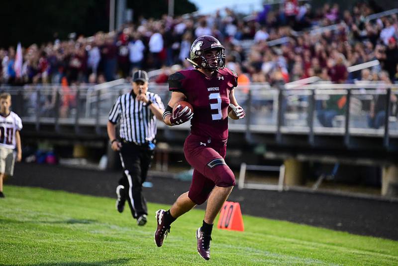 Marengo running back Finn Schirmer scores one of his six touchdowns in a win over Plano on Friday in Marengo.