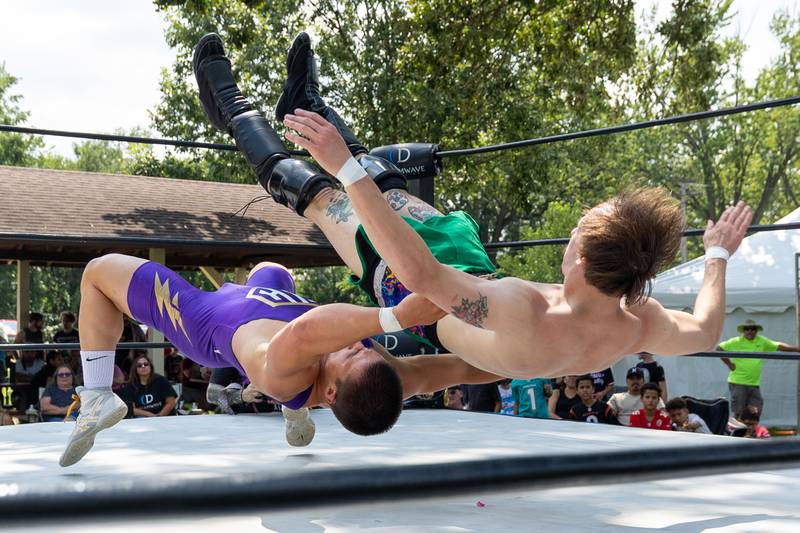 (left to right) Hunter Holdcraft of 'The Hype' german suplexes August Matthews of 'Bang and Matthews' at the Taste of the Illinois Valley DreamWave Wrestling event on Saturday, August 2, 2025 at Centennial Park in Peru.