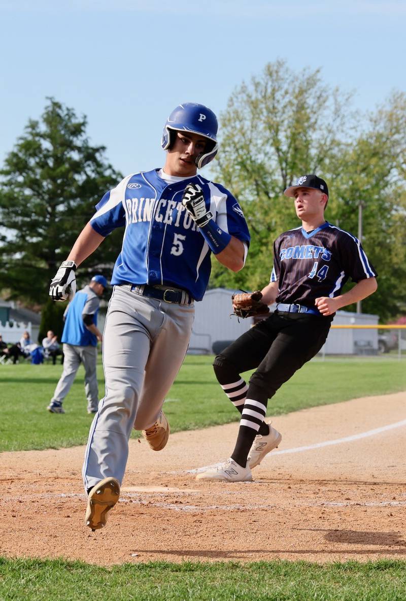 Princeton's Ace Christiansen scores a run on a wild pitch in the third inning of Tuesday's game at Prather Field. Newman won 3-2.