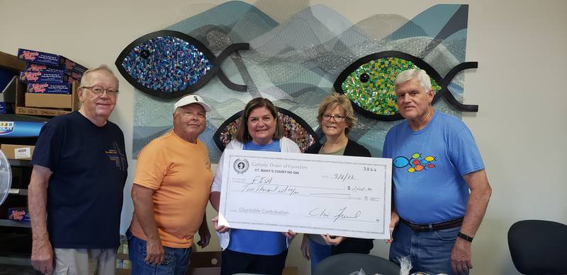 The McHenry Catholic Order of Foresters has donated $2,000 to the FISH food pantry in McHenry, bringing its total to $3,000 in donations this year. 
Pictured (L to R): Dennis Conway, Rich Meyers, Cindy Chicoine, Sue Kapraun, Jon Meyer