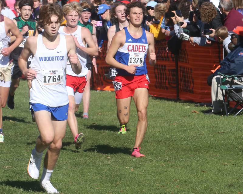 Woodstock's Ellery Shutt and Marmion Academy's Connor Carlson competes in the Class 2A State Cross Country race on Saturday, Nov. 4, 2023 at Detweiller Park in Peoria.