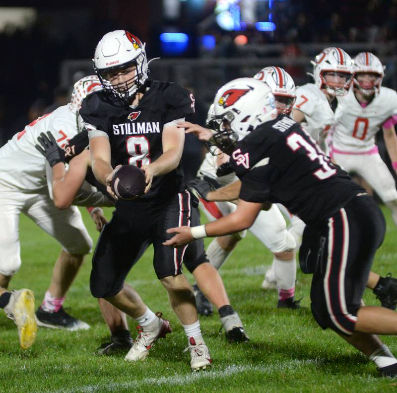 Stillman Valley quarterback Brandon Pittman (8) hands the ball off to Brady Stewart (34) on Friday, Oct. 10, 2025 against Oregon in Stillman Valley.