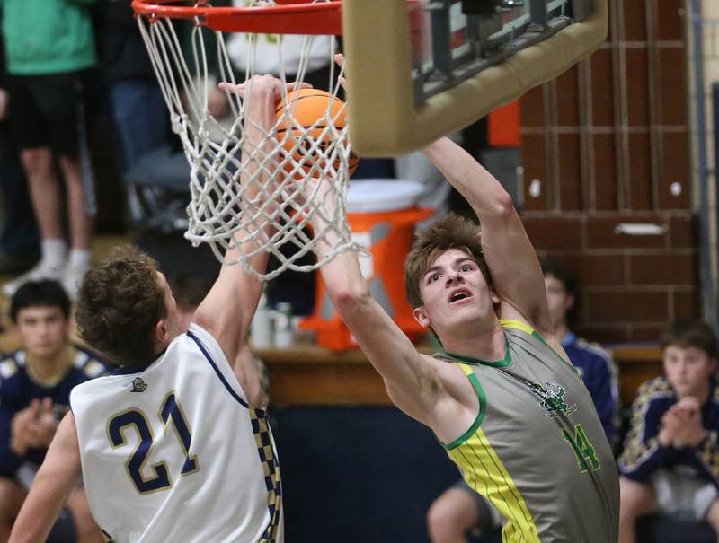 Marquette's Griffin Dobberstein blocks Seneca's Cameron Shriey shot on Friday, Feb. 21, 2025 in Bader Gym at Marquette Academy.