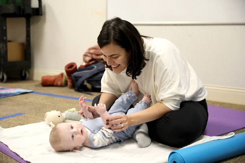 Alicia Hollander of Wheaton and her son, Lucas, 5 months, participate in a baby yoga class at Northwestern Medicine Central DuPage Hospital in Winfield.