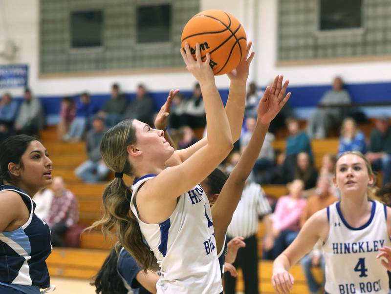 Hinckley-Big Rock's Payton Murphy gets a layup in front of two Illinois Math and Science Academy defenders during their game Thursday, Jan. 8, 2025, at Hinckley-Big Rock High School.
