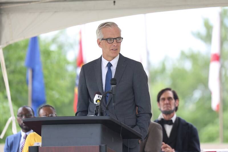 Denis McDonough, Secretary of Veteran Affairs, speaks at the National Cemetery Administration 50th Anniversary ceremony at the Abraham Lincoln National Cemetery in Elwood on Saturday, July 29.
