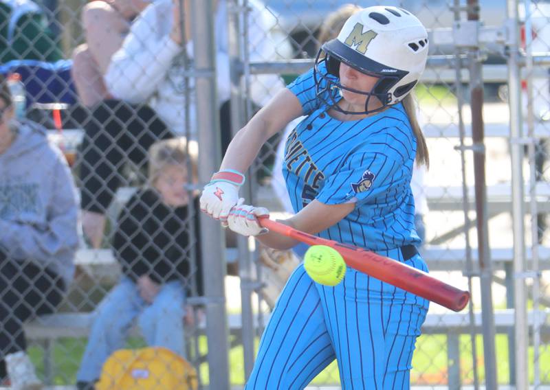Marquette's Chloe Thrush makes contact with the ball on Tuesday, April 23, 2026 at June Cross Field in Ottawa.