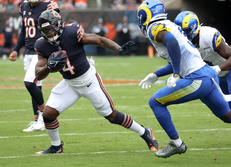 Chicago Bears running back D'Andre Swift gets around Los Angeles Rams safety Kamren Curl for a gain late in the first half of their game Sunday, Sept. 29, 2024, at Soldier Field in Chicago.