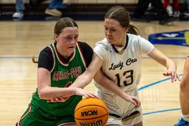 Photos: Marquette defeats L-P in girls basketball