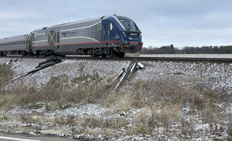 An Amtrak train travels through Bureau County as a light dusting of snow brushes up against the tracks on Thursday, Nov. 21, 2024 in  Princeton.
