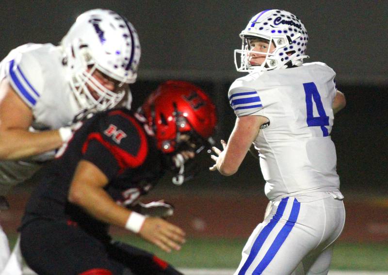 Burlington Central’s quarterback Jackson Alcorn looks for an option in varsity football at Huntley High School in Huntley on Friday, Oct. 25, 2024.