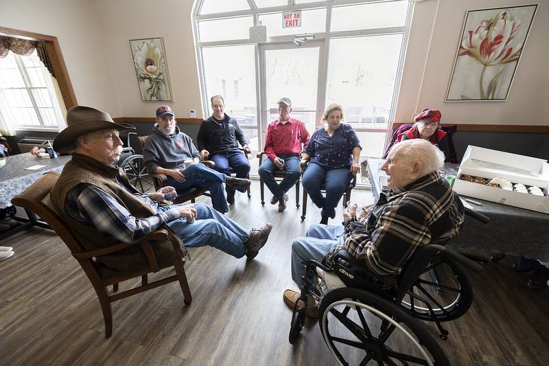 Bob Chamberlin (right) speaks to family during his 101st birthday celebration Friday, March 21, 2025, at Liberty Court.