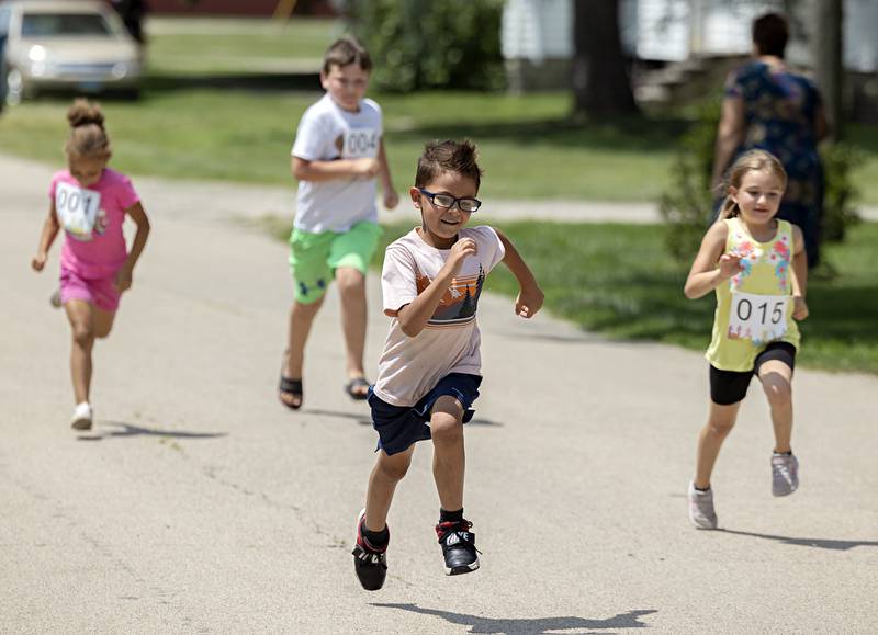 Fun runners sprint for the finish line Saturday, July 22, 2023 in Tampico. Five age groups of runners took part in the kid’s two-block run.