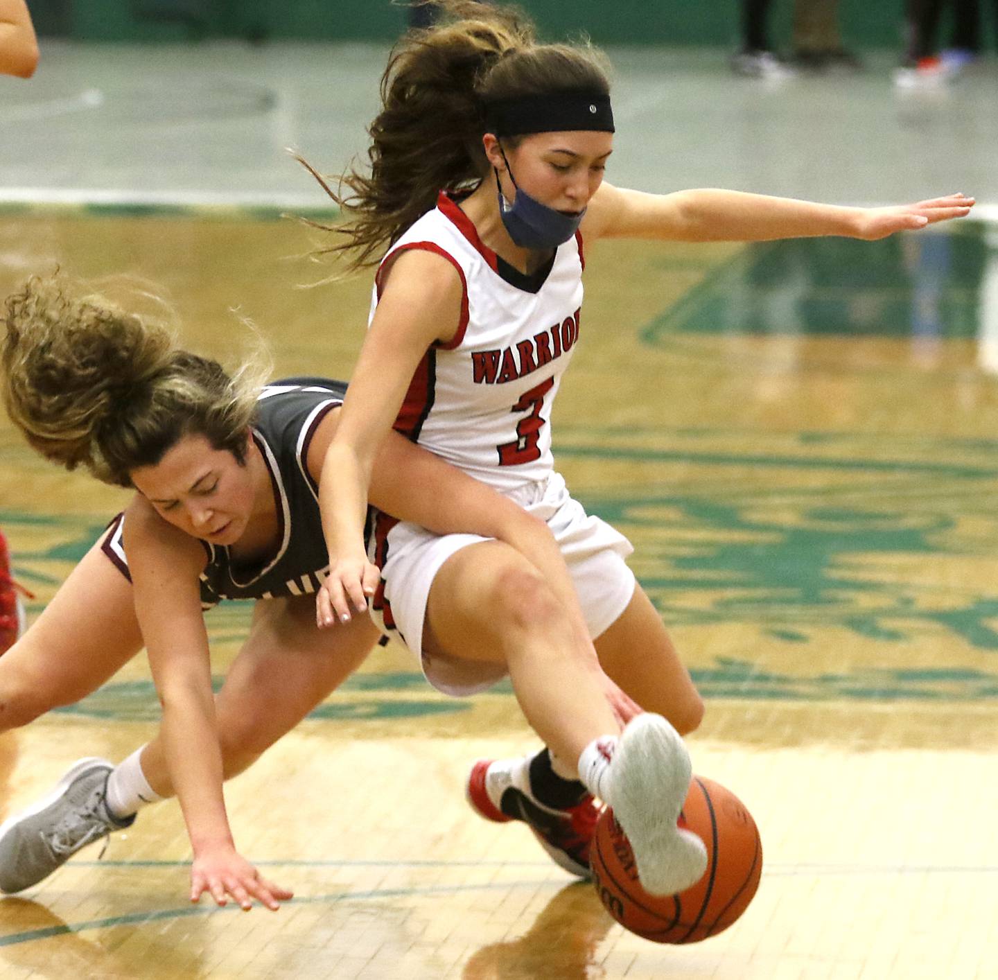 Prairie Ridge's Elani Nanos dives after a loose ball against Deerfield’s Aubrey Gavan during a IHSA Class 3A Grayslake Central Sectional semifinal basketball game Tuesday evening, Feb. 22, 2022, between Prairie Ridge and Deerfield at Grayslake Central High School.