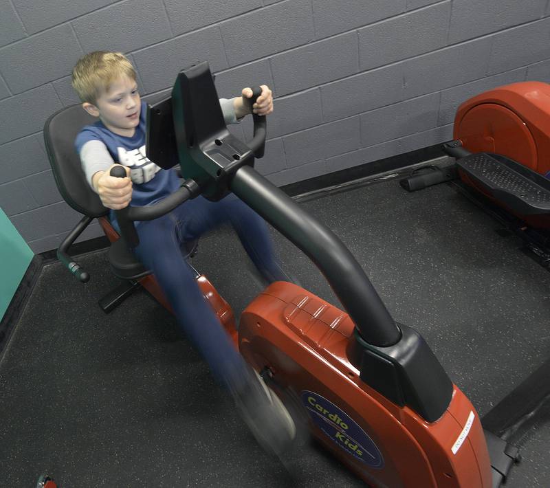 O’Conner Weddel pedals as fast as he can on a kids cardio machine Saturday, April 20, 2024, during the Healthy Kids Day at the Streator Y.
