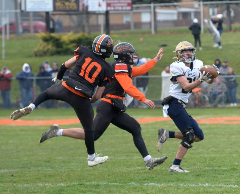 Polo's Noah Dewey (31) catches.a pass during 8-man playoff action against Milledgeville on Saturday, Nov. 16, 2024 at Milledgeville.
