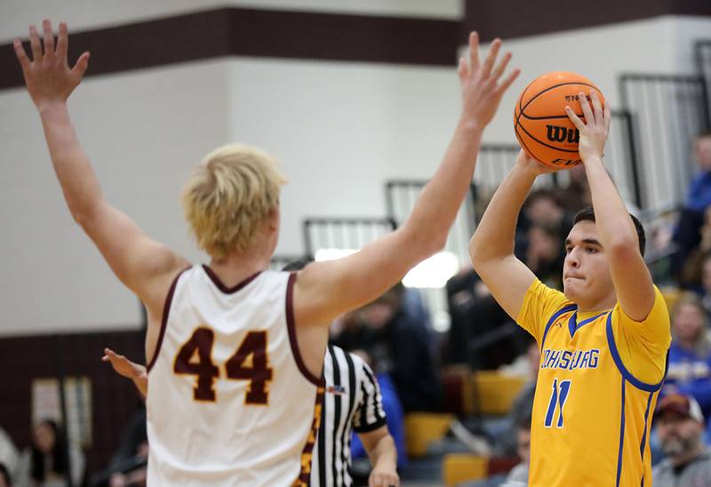 Johnsburg's Ryan Franze looks to pass as he is guarded by Richmond-Burton's Ray Hannemann during a Kishwaukee River Conference boys basketball game on Tuesday, Jan. 27, 2026, at Richmond-Burton High School.