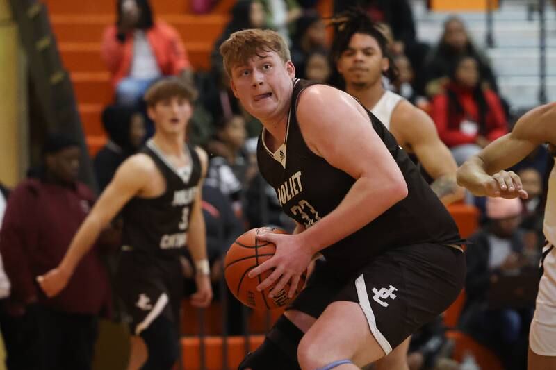 Joliet Catholic’s Anthony Birsa works under the basket against Prespectives in the Class 2A Julian Sectional championship on Friday, March 3rd, 2023 in Chicago.
