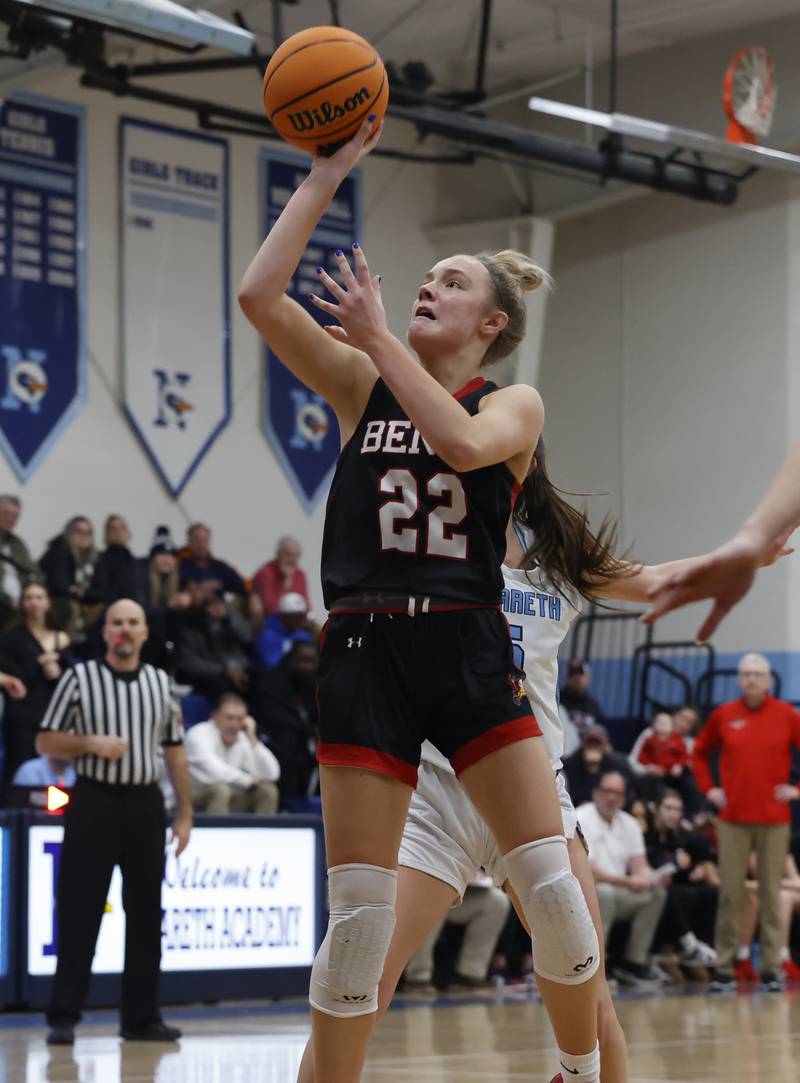 Benet's Bridget Rifenburg (22) takes a shot during a girls varsity basketball game between Benet and Nazareth academies on Saturday, Dec. 14, 2024 in La Grange Park.