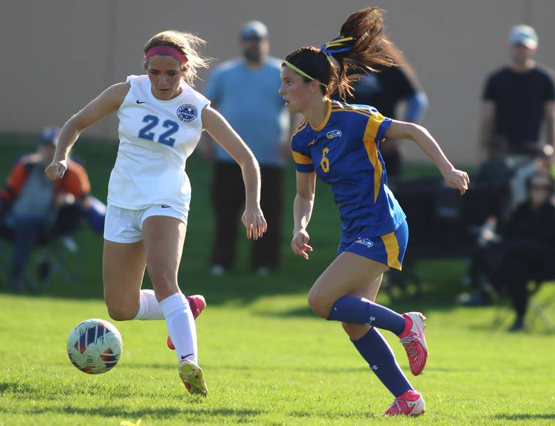 Johnsburg’s Liz Smith, right, battles Woodstock’s Haley Dix in varsity soccer on Wednesday, April 23, 2025, at Johnsburg High School in Johnsburg.