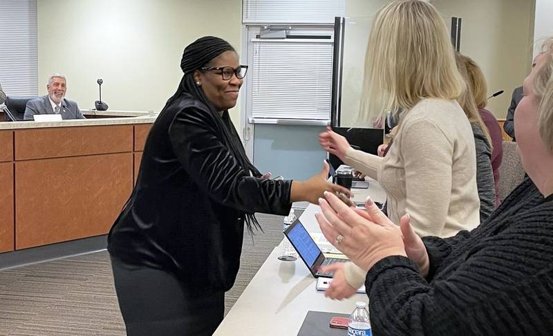 Martina Smith shakes hands with Community School District 300 staff members after being named the district's next superintendent. Smith, who currently serves as assistant superintendent for Title I schools in District 300, will replace Susan Harkin, who announced in October her plans to retire at the end of the 2023-24 school year.