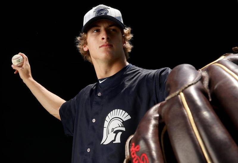 Cary-Grove pitcher Quinn Priester poses for a portrait at Cary-Grove High School on Friday, June 7, 2019 in Cary.  Priester, a football standout as well as baseball phenom, was selected as the baseball player of the year as well as the male athlete of the year.