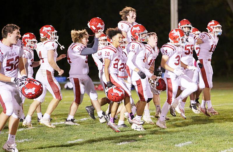 Mambers of the Hall Red Devil react after defeating St. Bede on Saturday, Oct. 15, 2022 at the Academy in Peru.