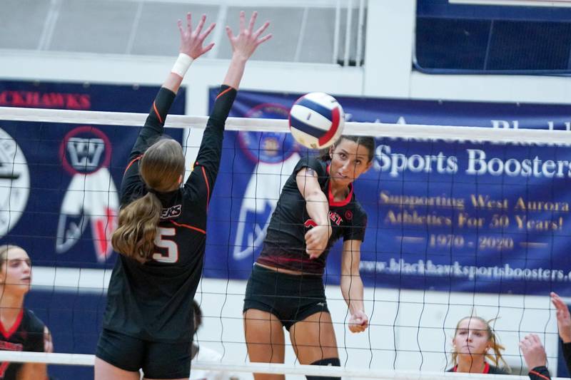 Benet’s Gabriele Stasys (2) watches her kill attempt sail past the arms of Wheaton Warrenville South's Katie Dragas (15) during a Class 4A West Aurora Sectional semifinal volleyball match at West Aurora High School on Tuesday, Nov. 5, 2024.