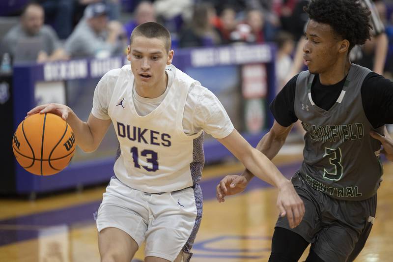 Dixon’s Cullen Shaner handles the ball against Plainfield Central’s Zion Finch Friday, Jan. 3, 2025, at Dixon High School.