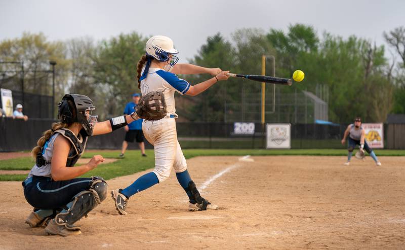 St. Charles North's Sophia Olman (10) drives the ball deep against Lake Park during a softball game at St. Charles North High School on Wednesday, May 11, 2022.