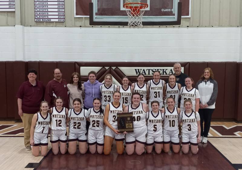 The Watseka-Milford girls basketball team poses with their plaque after beating Hoopeston in the championship game of the IHSA Class 2A Watseka Regional on Feb. 20, 2025.