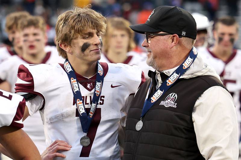 Prairie Ridge's Tyler Vasey and head coach Chris Schremp get together after their IHSA Class 6A state championship loss to East St. Louis Saturday, Nov. 26, 2022, in Memorial Stadium at the University of Illinois in Champaign.