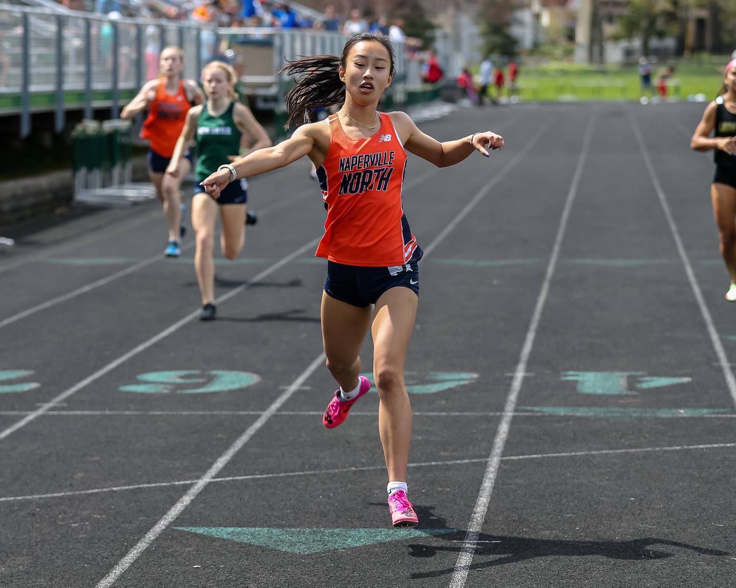 Naperville North's Christina Gu finishes first in the 400 yard dash at the Glenbard West's Sue Pariseau Girls Track and Field Invitational.  April 23.2022.