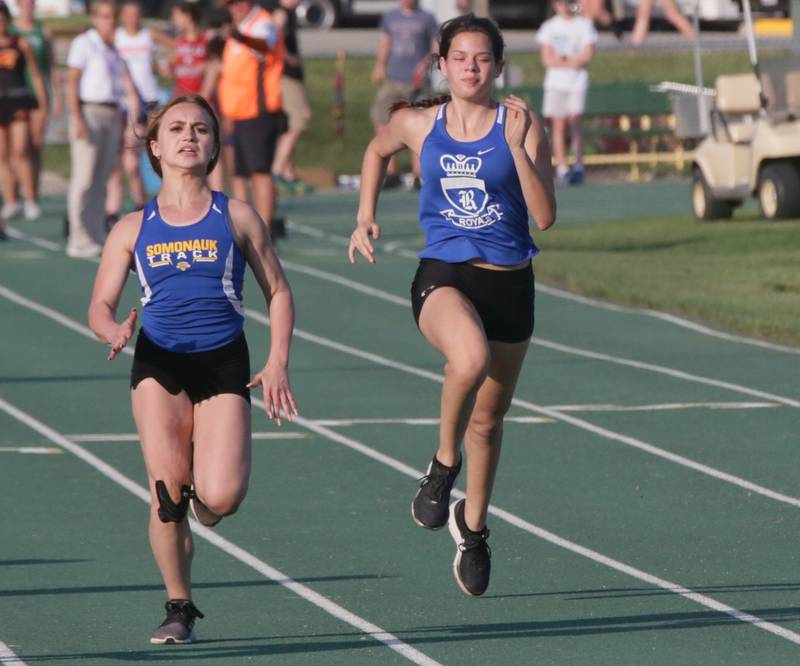 Somonauk's Taleigh Mullen and Hinckley Big Rock's Raven Wagner compete in the 100 meter dash in the Class 1A sectional girls track meet on Thursday, May 12, 2022 in Seneca.