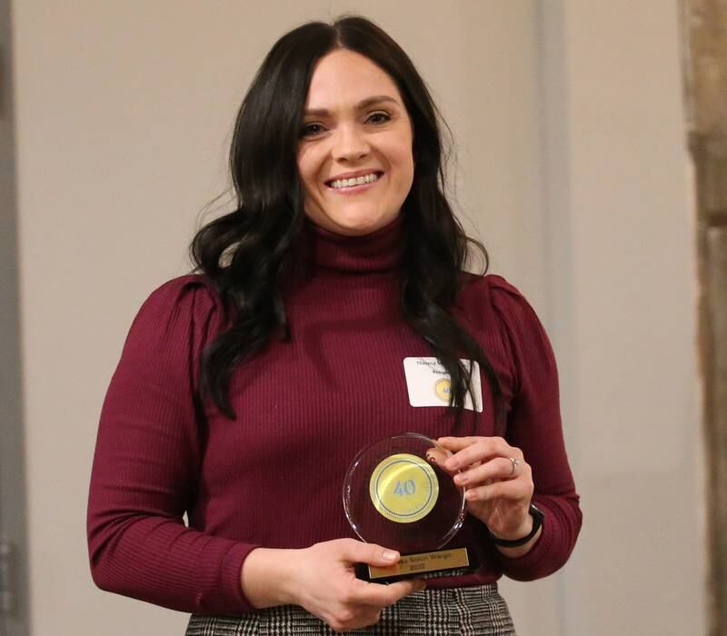 Theresa Solon Wargo, Owner, Theresa Solon State Farm Agency poses for a photo with her award during the Illinois Valley Chamber of Commerce 40 Under Forty Awards Gala on Thursday, Feb. 9, 2023 at Westclox in Peru.