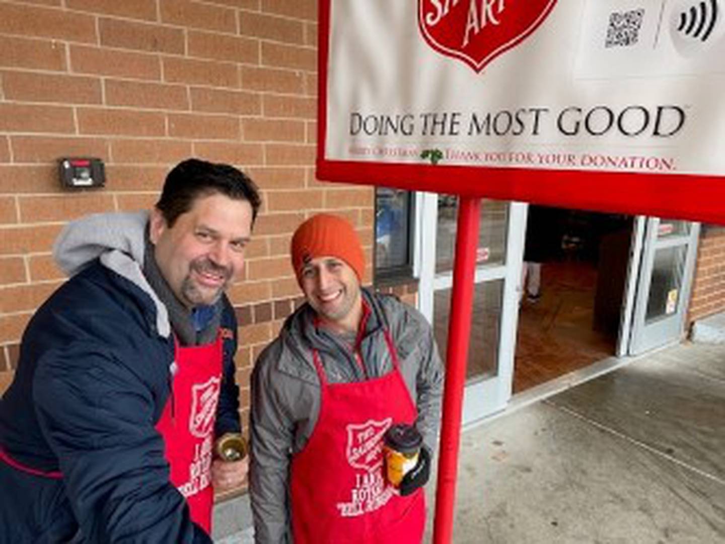 Joliet Rotarians (from left) Pete Colarelli and Nick Moran volunteer for the Salvation Army during the Christmas holidays.