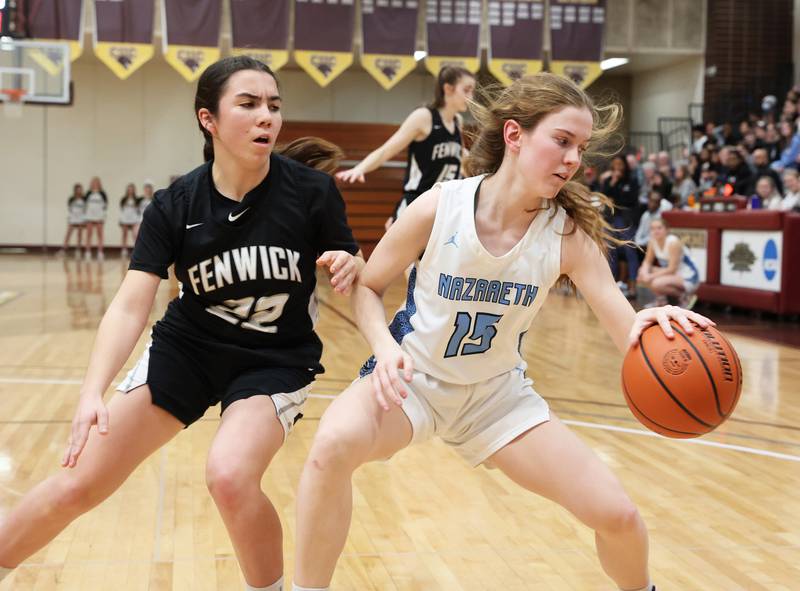 Nazareth's Mary Bridget Wilson (15) dribbles under the basket during the girls 3A varsity super-sectional game between Nazareth Academy and Fenwick High School in River Forest on Monday, Feb. 27, 2023.