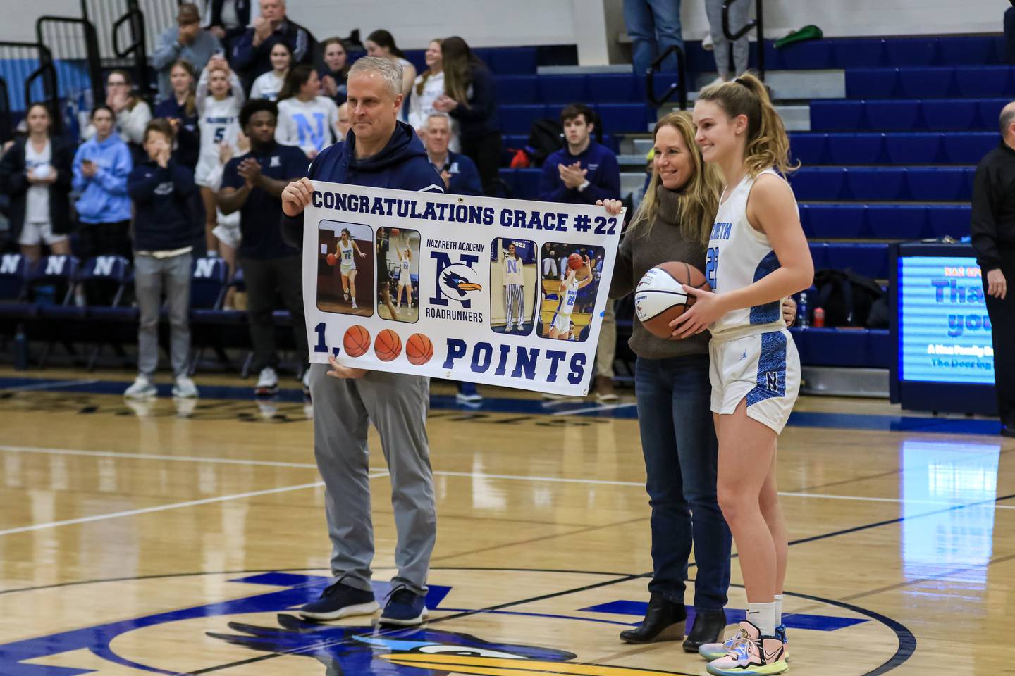 Nazareth's Grace Carstensen (22) is recognized for her 1,000 points scored before varsity basketball game versus Deerfield.  Jan 23, 2023.