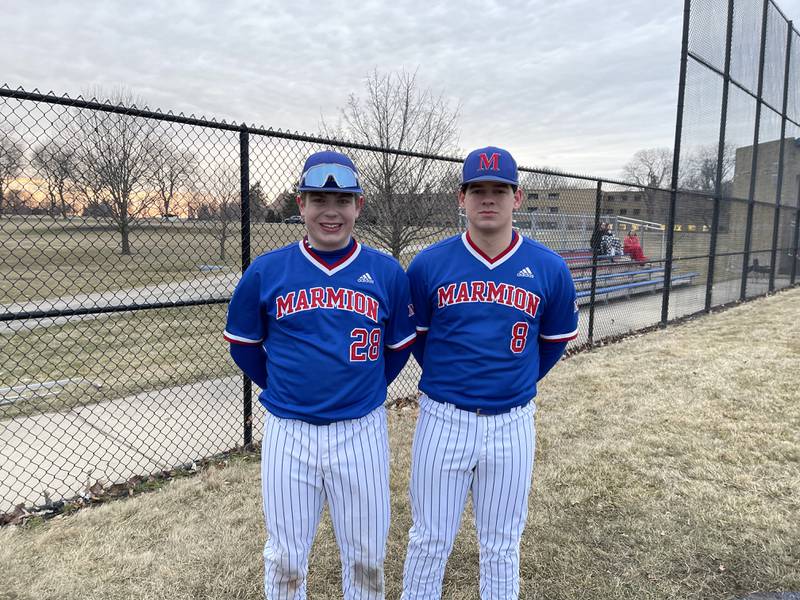 Marmion sophomore Ethan Flores (left) and senior Zach Bostrand together after their combined no-hitter against St. Charles North on Tuesday.