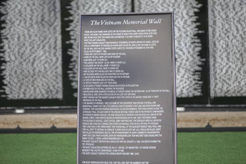 A sign in front of the Vietnam Traveling Memorial Wall Thursday, Aug 21, 2025  in Romeoville.