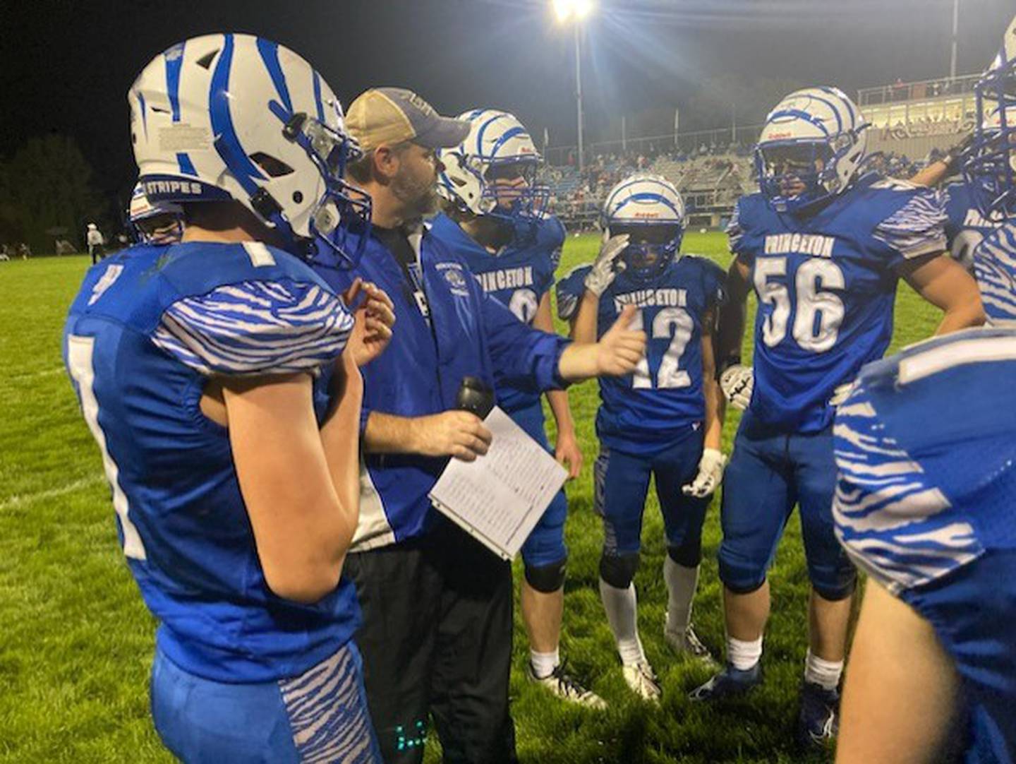 Princeton coach Ryan Pearson talks with his F/S players during a timeout in the second half of Friday's game at Bryant Field.