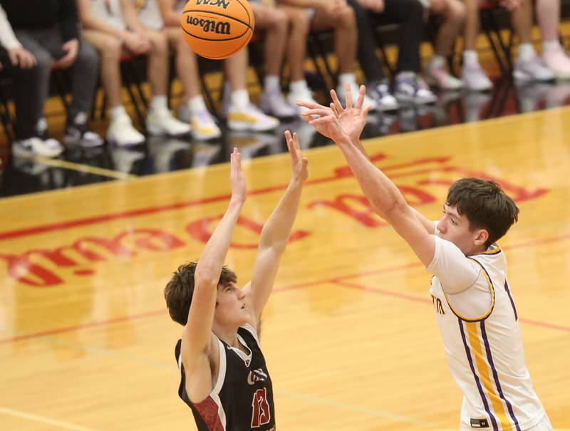 Mendota's Cole Tillman lets go of a shot over Illinois Valley Central's Koi Morrow during the Colmone Classic on Friday, Dec. 12, 2025 at Hall High School.