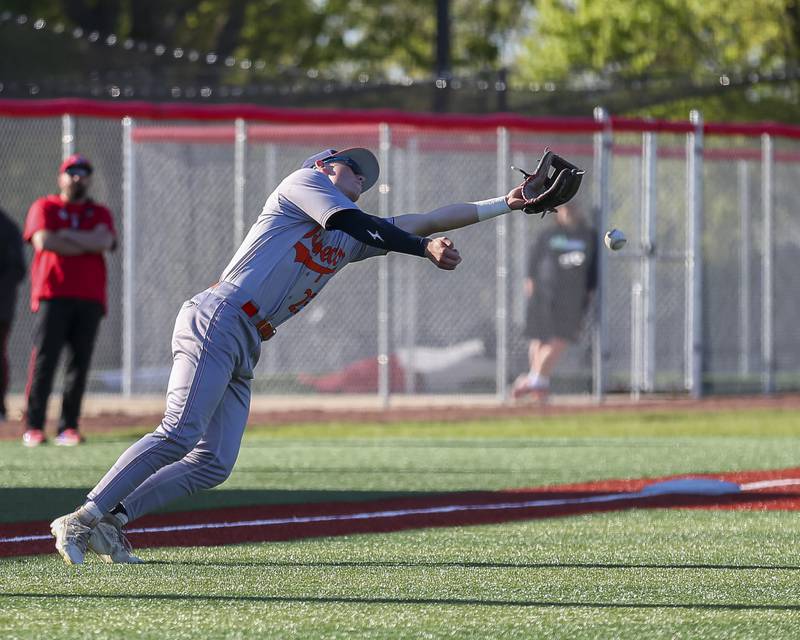 Oswego's Conor Tully (23) has a short fly elude him at third during baseball game between Oswego at Yorkville. Thursday, May 8, 2025 in Yorkville.