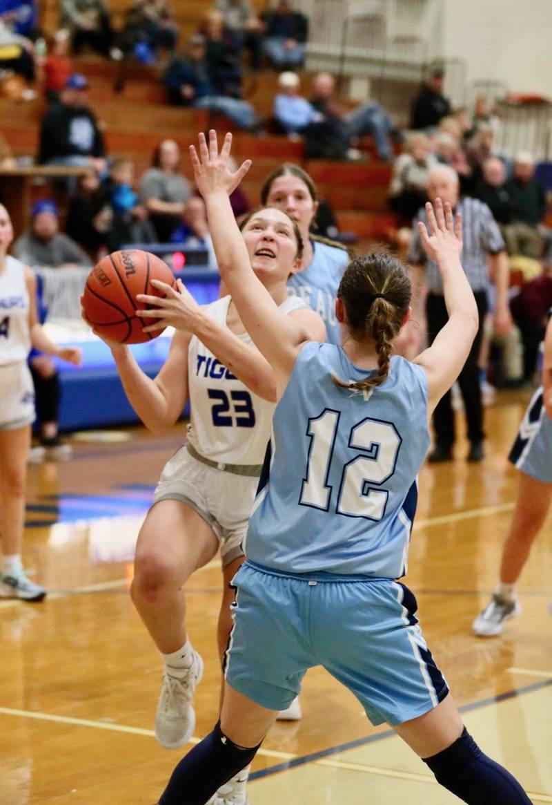 Princeton's Miyah Fox takes in a layup over Bureau Valley senior Kate Stoller Tuesday night at Prouty Gym. The Storm won 55-45.