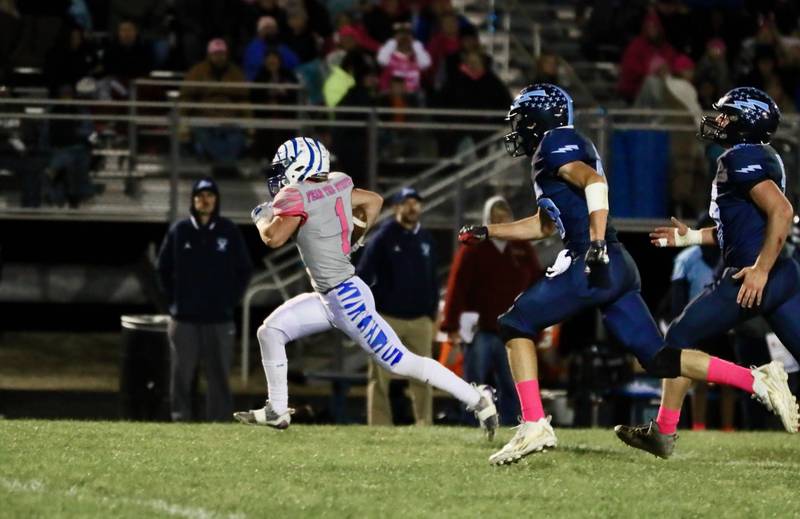 Princeton's Casey Etheridge races away for a long gainer at Bureau Valley Friday night. He scored three touchdowns in the Tigers' 42-0 win over the rival Storm.