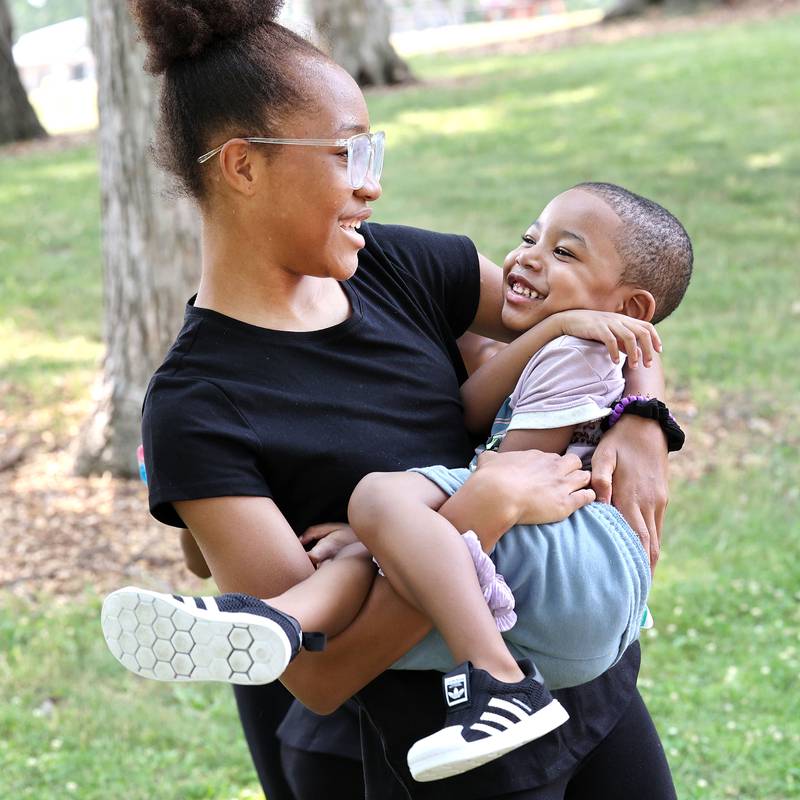 Zoey Hollins, 12, and RJ Wilkins, 2, from Cortland, dance to the music played by the DJ at the Juneteenth Community Celebration Sunday, June 18, 2023, at Hopkins Park in DeKalb. The event featured vendors, food, music, games, and more.