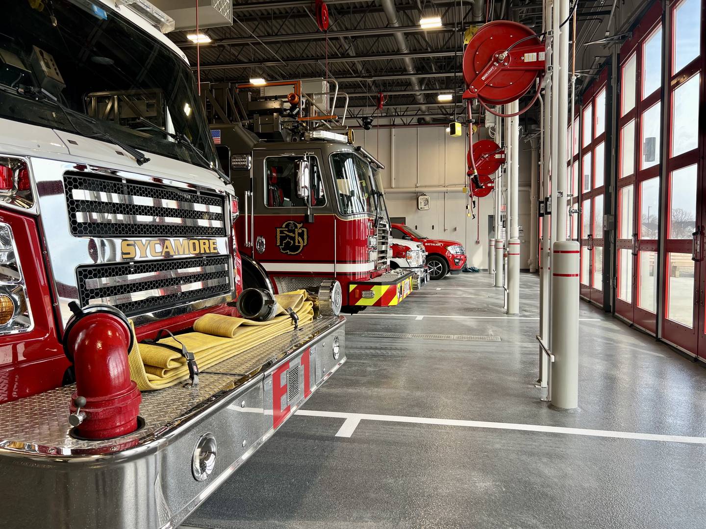 Fire trucks and emergency vehicles sit in the new garage on Tuesday, Feb. 17, 2026, at the Sycamore Fire Department's new fire station, 1351 S. Prairie Drive.  The station will replace the aging building at 535 DeKalb Ave. The department held a ceremony Tuesday to mark the opening.