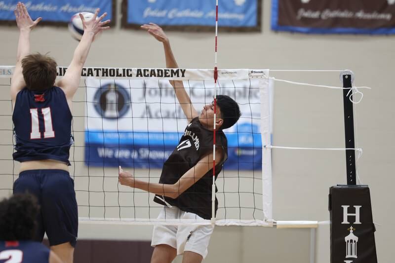 Joliet Catholic’s Aydan Garcia hits a shot down the line against St. Viator on Wednesday, April 24, 2024 in Joliet.