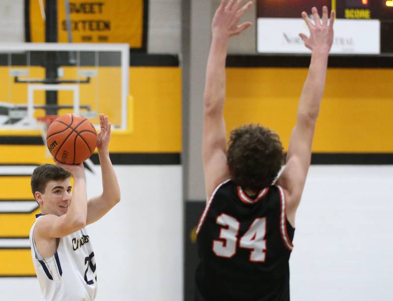 Marquette's Denver Trainor shoots a jump shot over Roanoke-Benson's Kaden Harms during the Tri-County Conference Tournament on Wednesday, Jan. 25, 2023 at Putnam County High School.